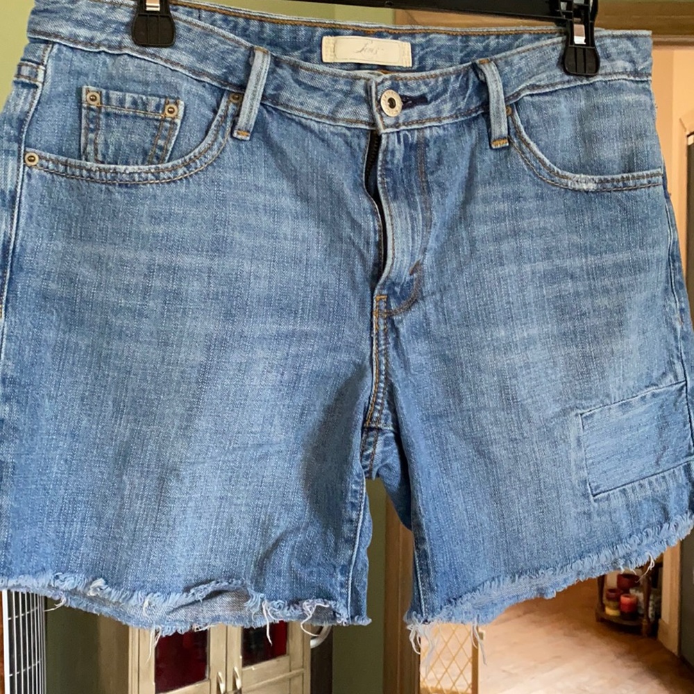 Levi’s mid length cut off shorts.